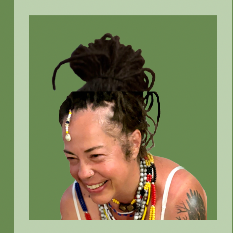 Smiling person with dreadlocks and vibrant ancestral beaded jewelry against a green background.