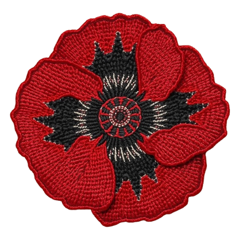 Embroidered Poppy Red and black embroidered poppy with intricate petals and a central design symbolizing healing with the ancestors and spirits.